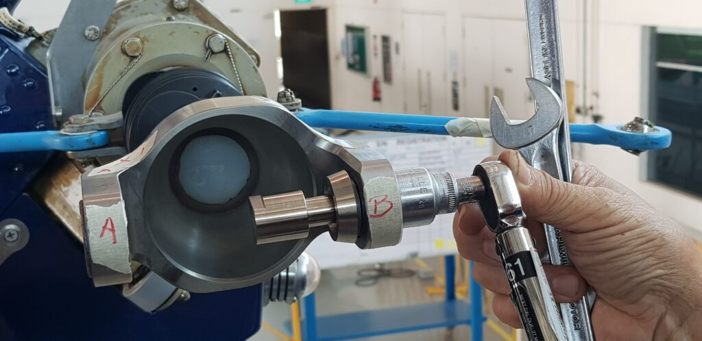 Technician utilizing precision tools on tail rotor.